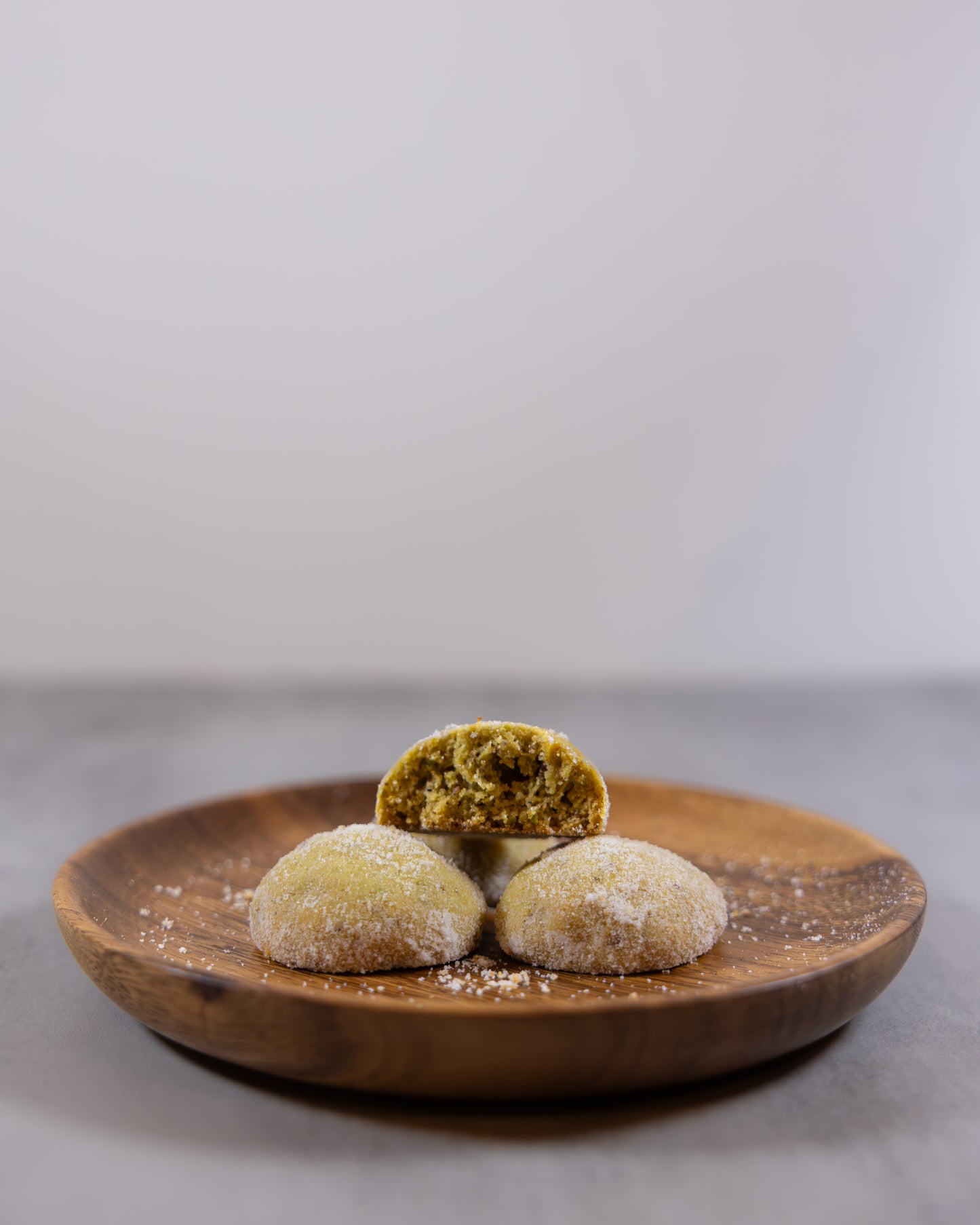 Pistachio snowball cookies with Sicilian Pistachio crunches, crafted by Okaeri Bakery in London